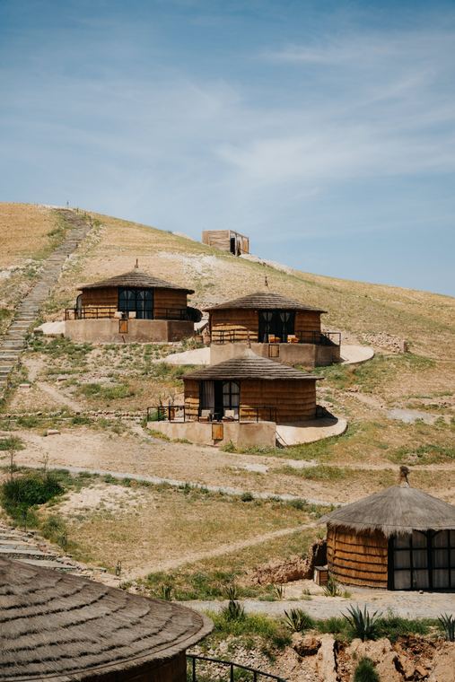 Round thatched cabins on the hillside