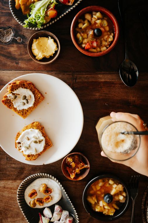 Breakfast from above with cake, jams and a shake