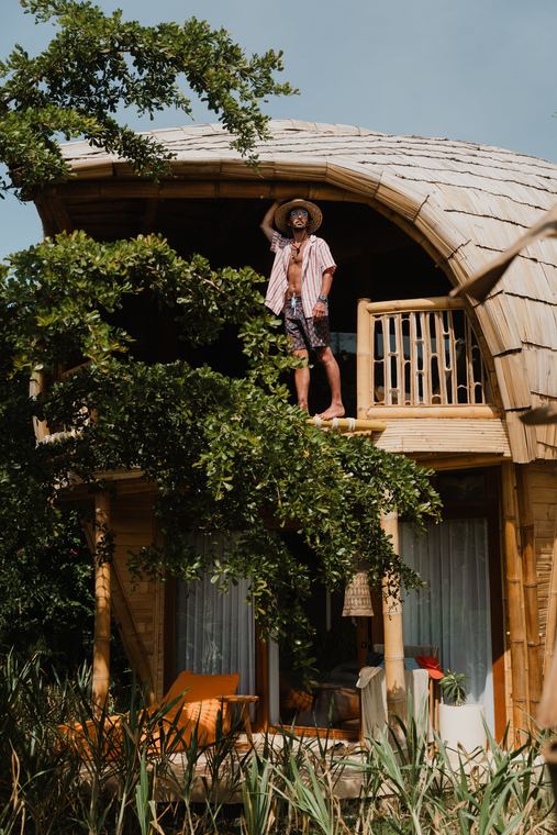On the balcony of a bamboo villa